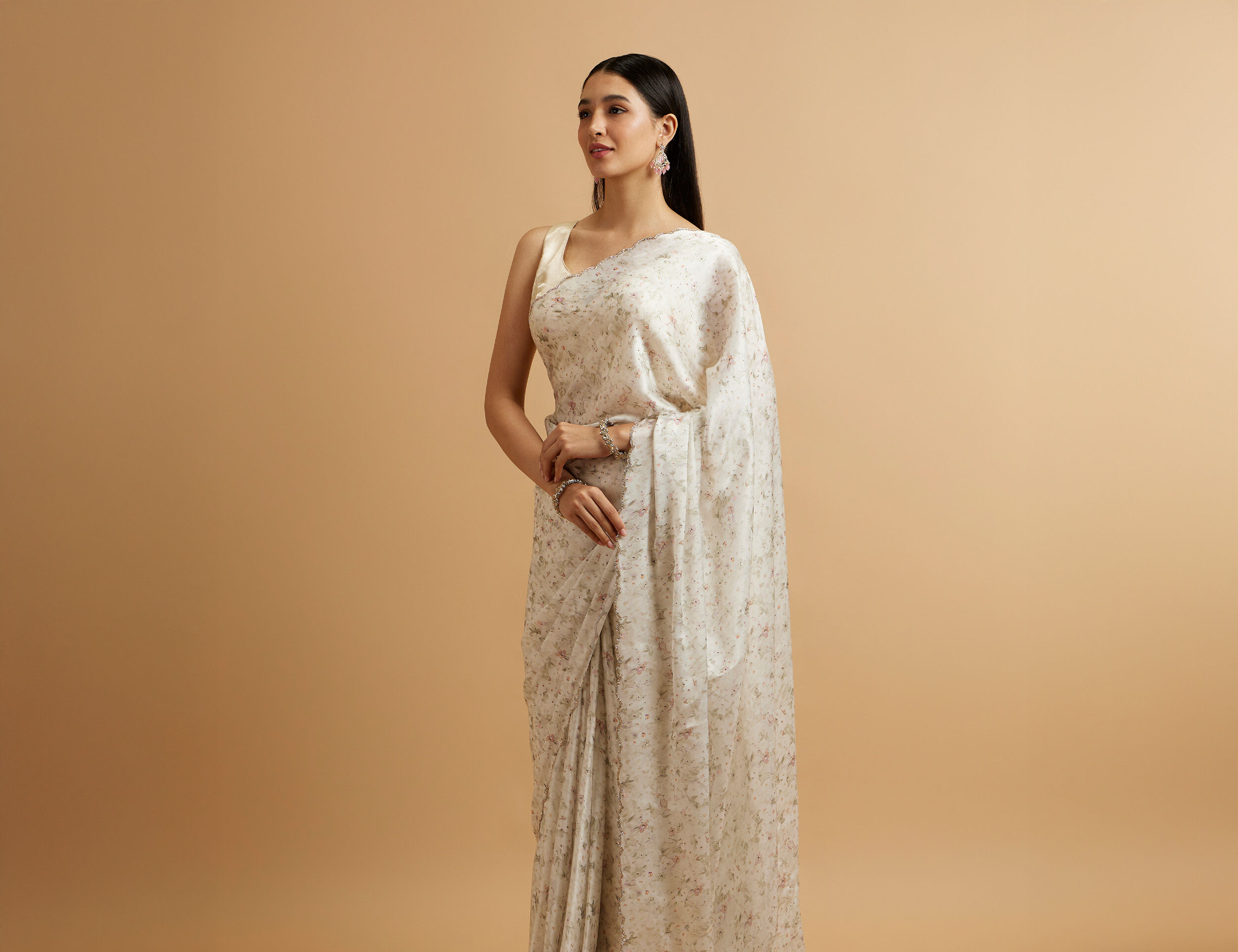 Girl wearing white small print saree styled for a minimal wedding look